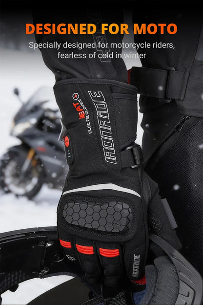Winter heated motorcycle gloves with protective knuckle design, worn in snowy outdoor setting